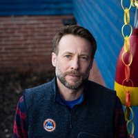 This is a portrait of a man smiling.