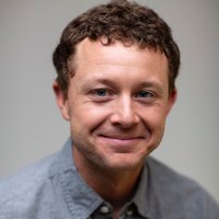 A portrait of a man smiling