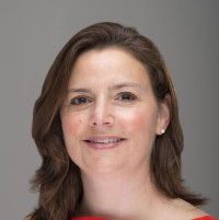 A portrait of a woman smiling.