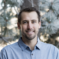 This is a portrait of a man smiling.