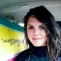 A portrait of a woman smiling.