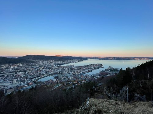 This is an aerial photo of a coastal town during a sunset.