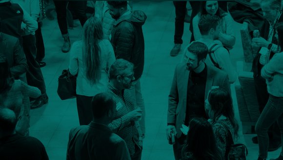 Cocktail hour showing people mingling and talking.