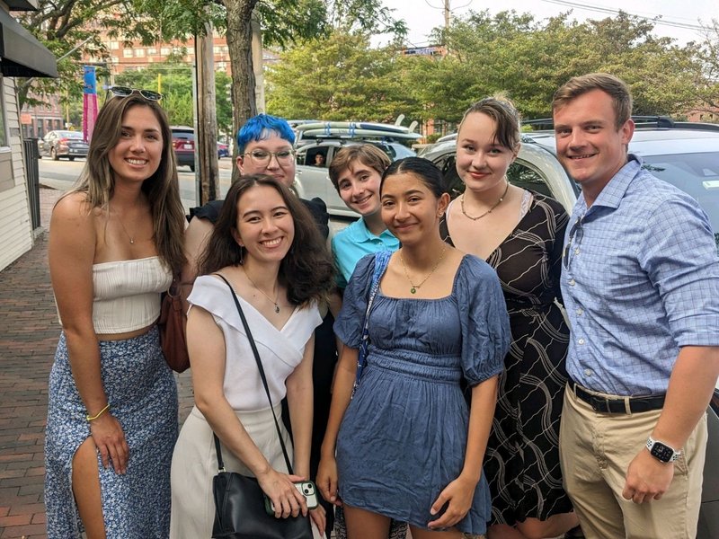 A group of young adults pose for a photo.