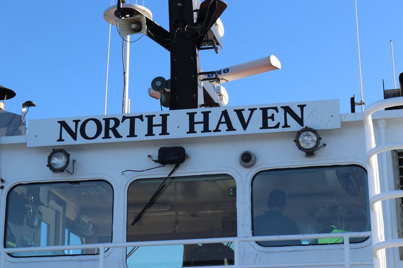 The back of a ferry boat reads "North Haven".