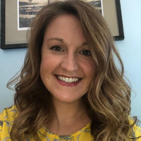 This is a portrait of a woman smiling.