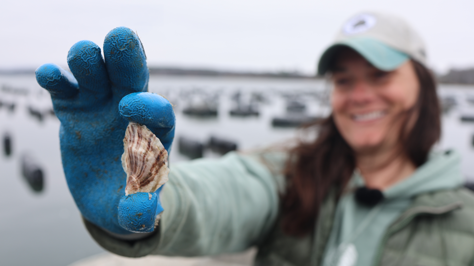 Kat Lipp holding an oyster.