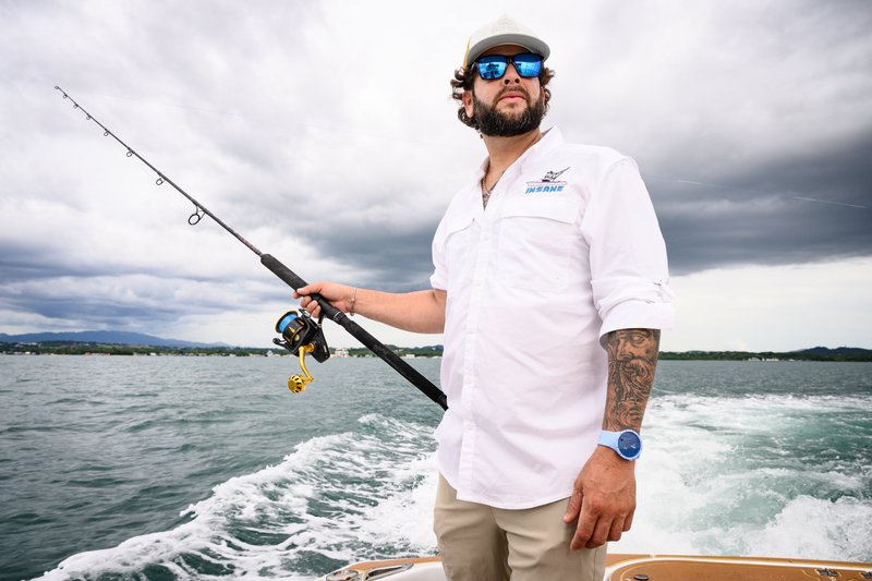 A charter fisherman in Puerto Rico standing on the back of his vessel.