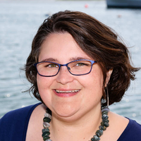 Portrait of a woman smiling.