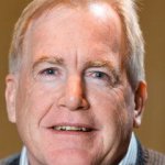 Portrait of a man smiling.