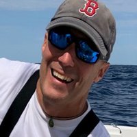 A portrait of a man smiling.