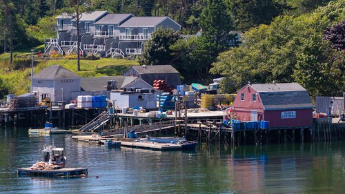 Mackerel Cove, full of docks, boats, lobster traps, and lots of shoreside infrastructure and housing.