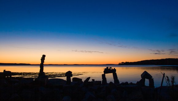 Rock art on a beach at sunset