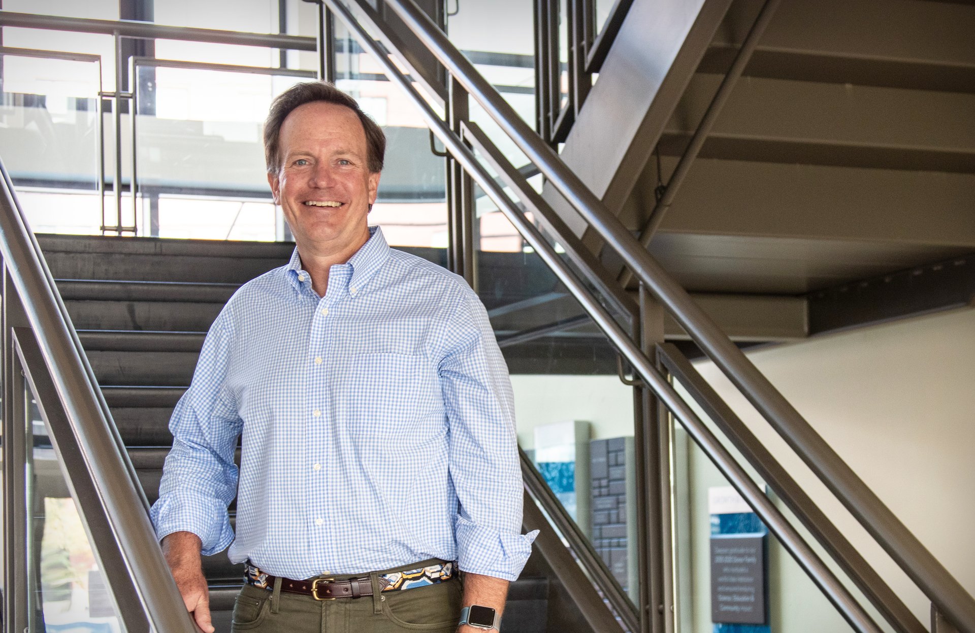 A portrait of Glenn Prickett on the stariwell at GMRI.