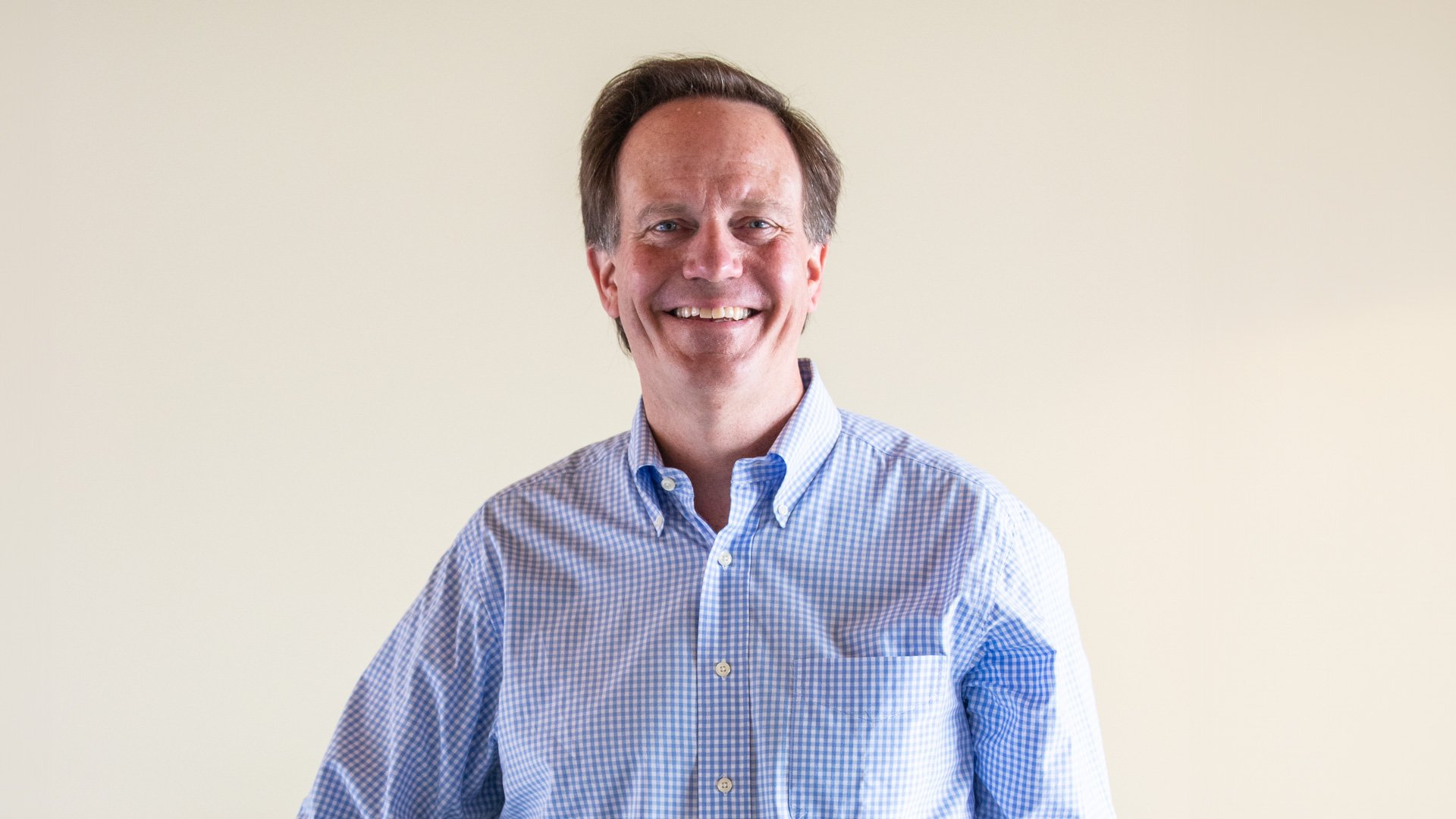 This is a portrait of a man smiling.
