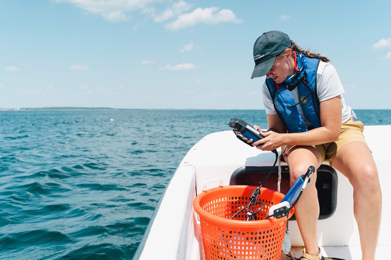 Samantha Bengs measures temperature, salinity, and dissolved oxygen in Casco Bay