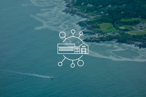 This is is line graphic in white layered on top of an aerial shot of a coastline with a small goat heading to the bottom right, leaving a white wake behind it. The graphic is a building inside a circle that has lines coming out in all directions connecting to other circles.