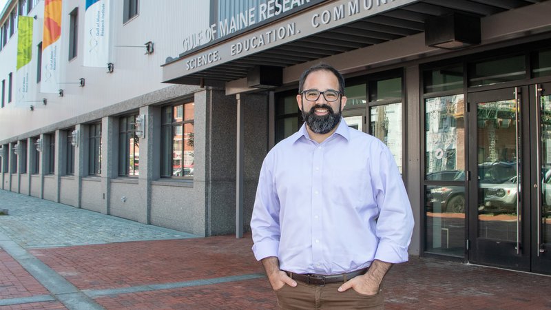 Dr. David Reidmiller stands outside the Gulf of Maine Research Institute lab on Commercial St. in Portland, Maine.