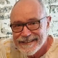 This is a portrait of a man smiling.